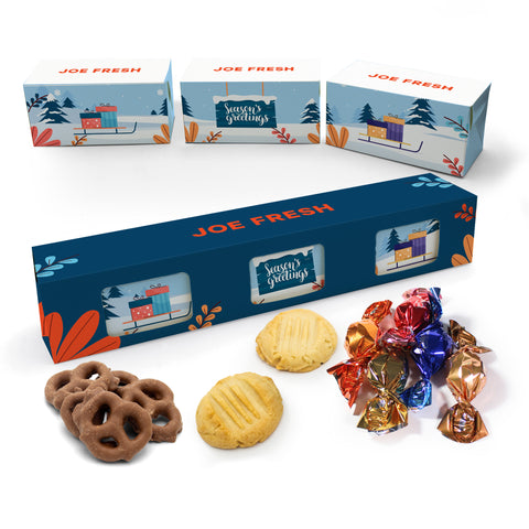Holiday gift box with cookies, chocolate pretzels, and wrapped chocolate truffles on a white background